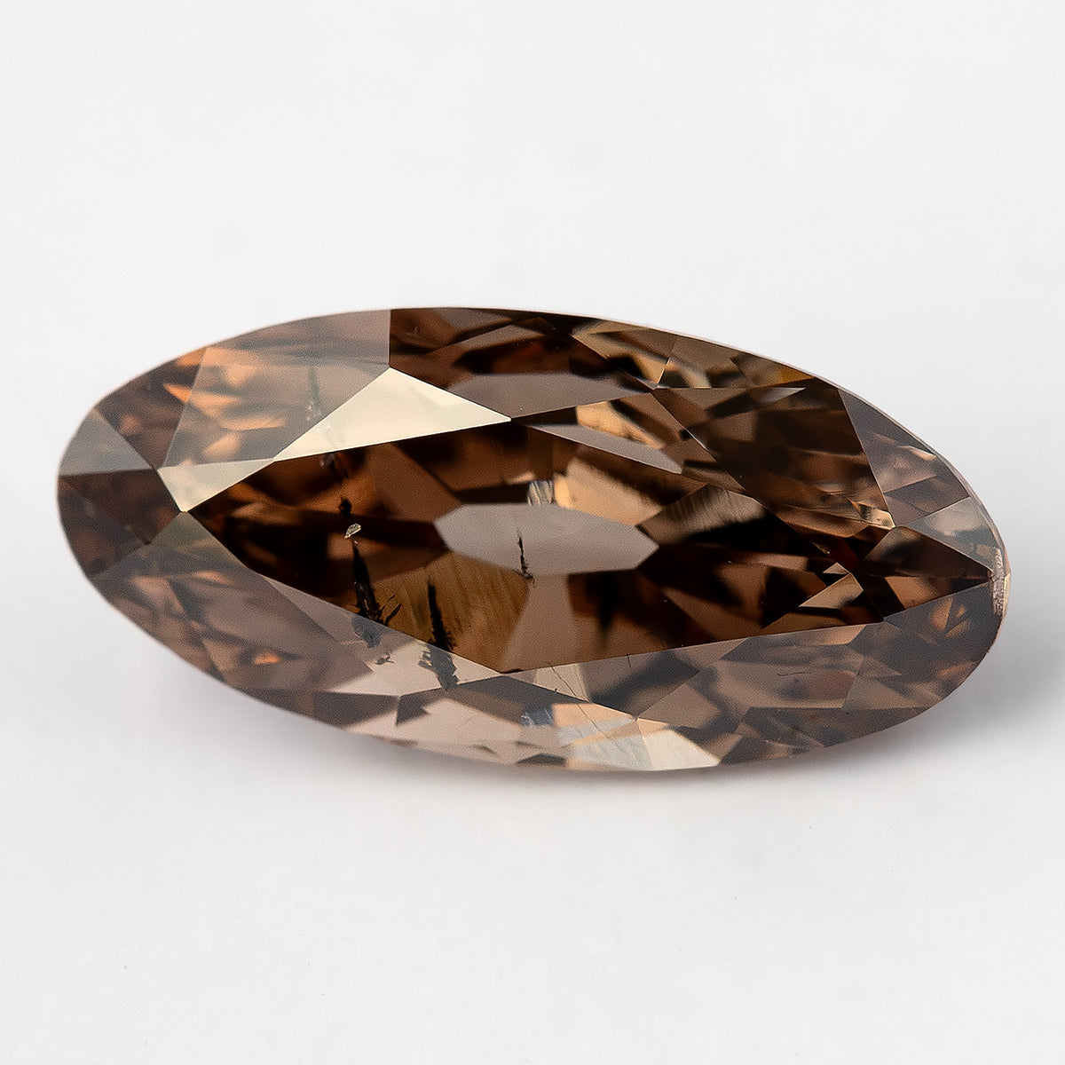 1.43 ct pinkish-brown lab-grown elongated oval diamond, angled face-up view, SKU BLD154