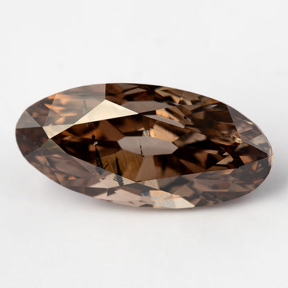 1.43 ct pinkish-brown lab-grown elongated oval diamond, angled face-up view, SKU BLD154