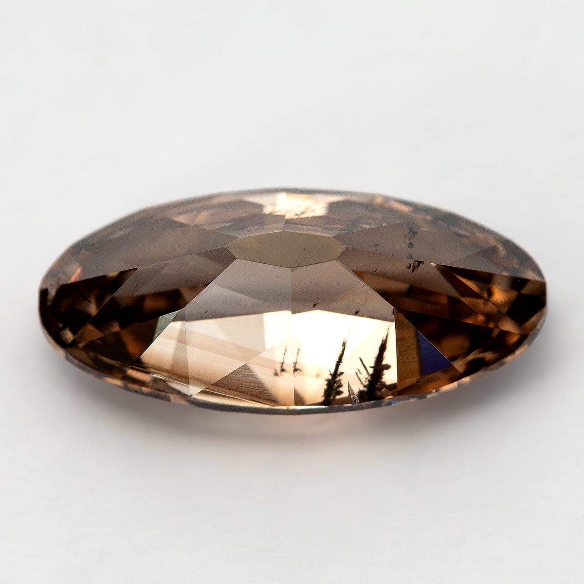 1.43 ct pinkish-brown lab-grown elongated oval diamond, side-lit profile, SKU BLD154