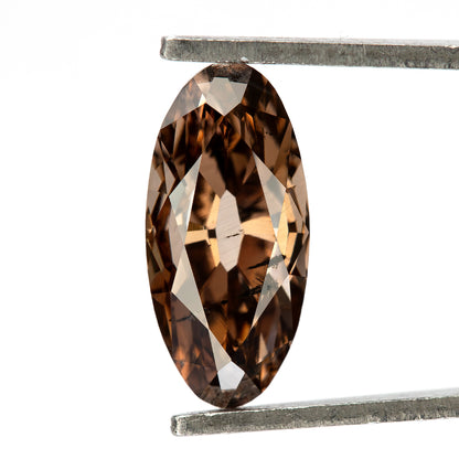 1.43 ct pinkish-brown lab-grown elongated oval diamond, held vertically in tweezers, SKU BLD154