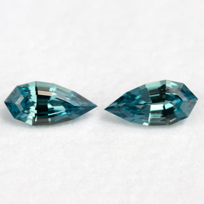 Face-up view of the closely matched BLS114 teal lab-grown sapphire pair.