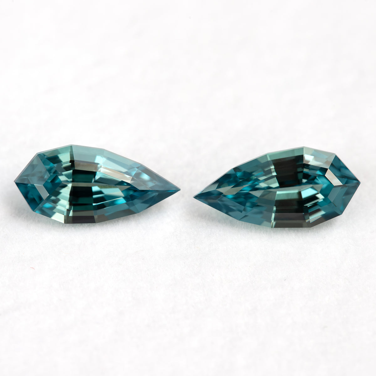 Alternate view of the two elongated pear BLS114 sapphires as a matched pair.