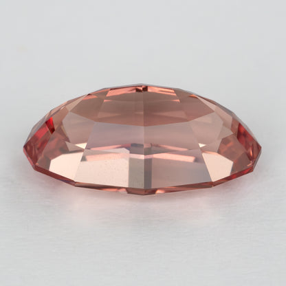 Low side view of the lab-grown sapphire showing its profile and facet tiers.
