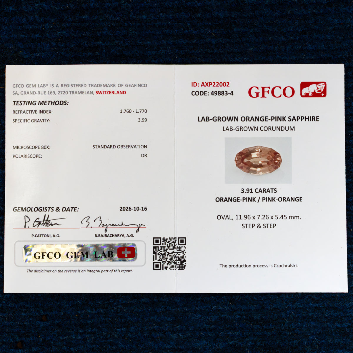 Pictured GFCO sample report AXP22002 for lab-grown orange-pink sapphire; each supplied gemstone includes its individual report.