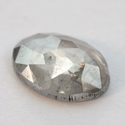 Another low-angle view of the oval diamond and its domed crown facets.