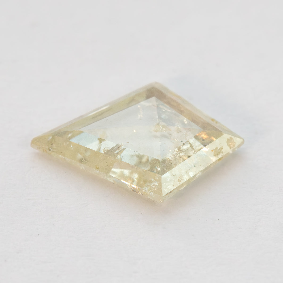 Low oblique view of the kite diamond on a pale surface, showing its depth.