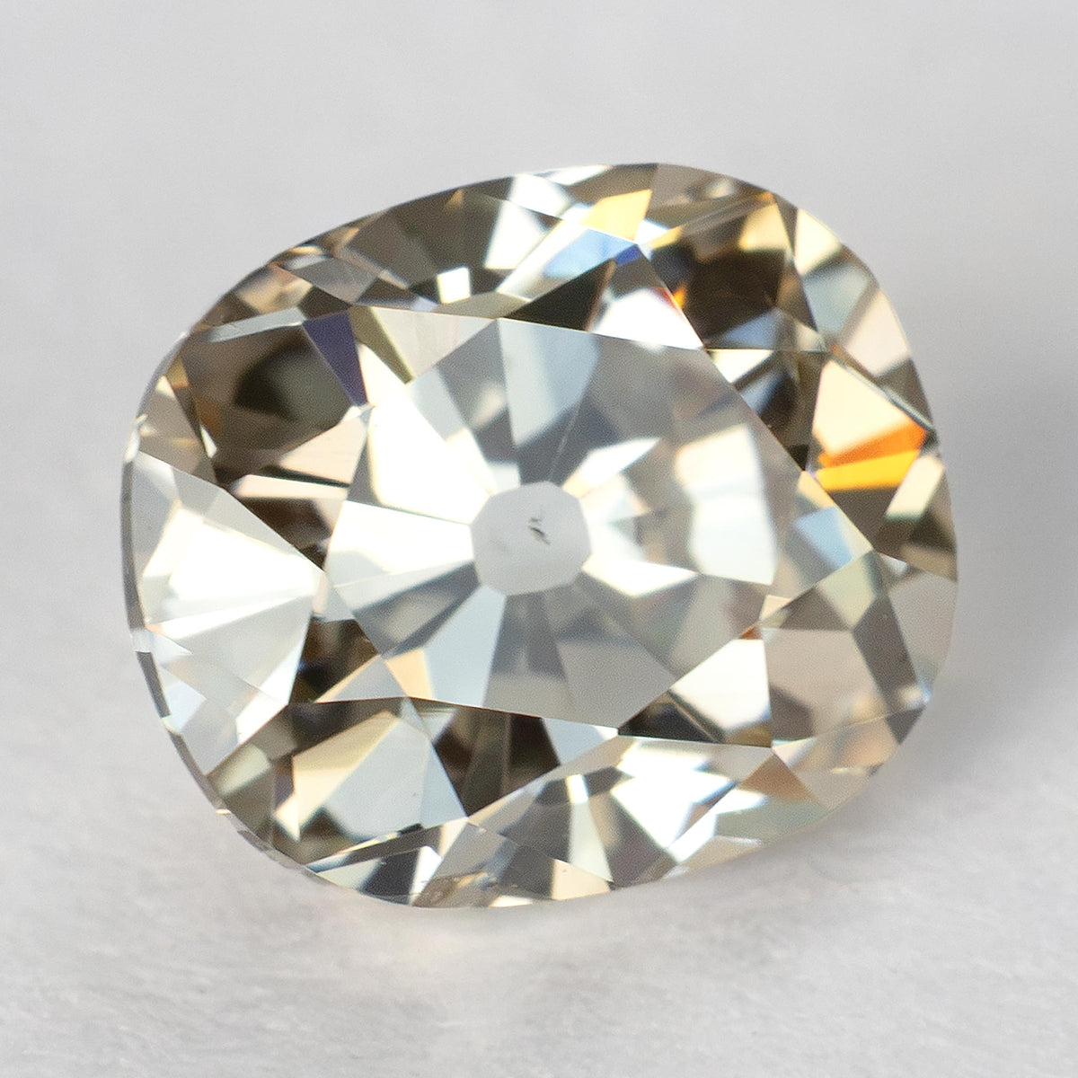 Slightly angled face-up view of the Old Mine Cut diamond, showing bright reflections and its large culet.