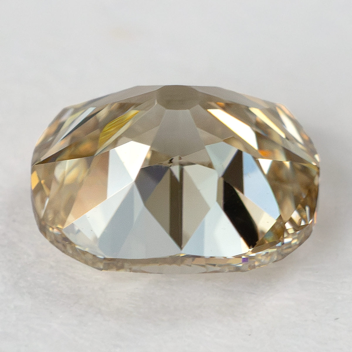 Side profile of the diamond resting on its crown, showing the girdle, pavilion depth and large culet facet.