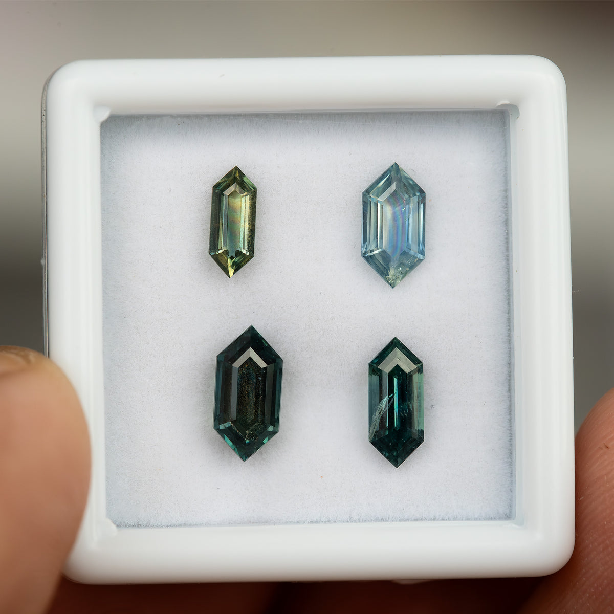 Alternate gemstone-box view of the four exact sapphire options.