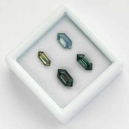 Angled group view showing facets and proportions across the four sapphires.