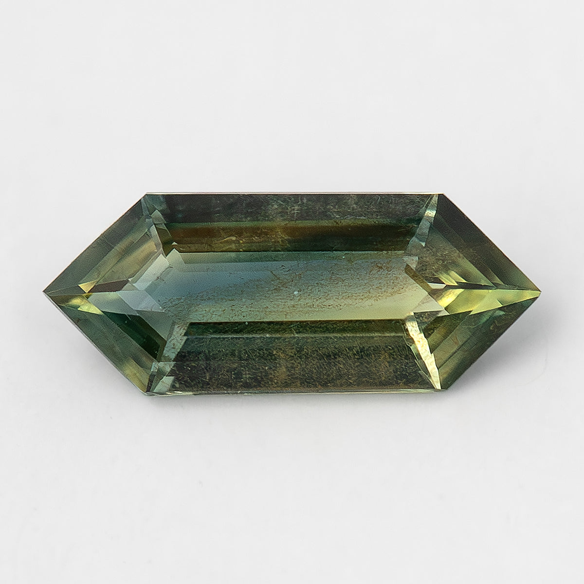 Available #1 BNS151 olive-green natural sapphire in a Dutch marquise elongated hexagon cut.