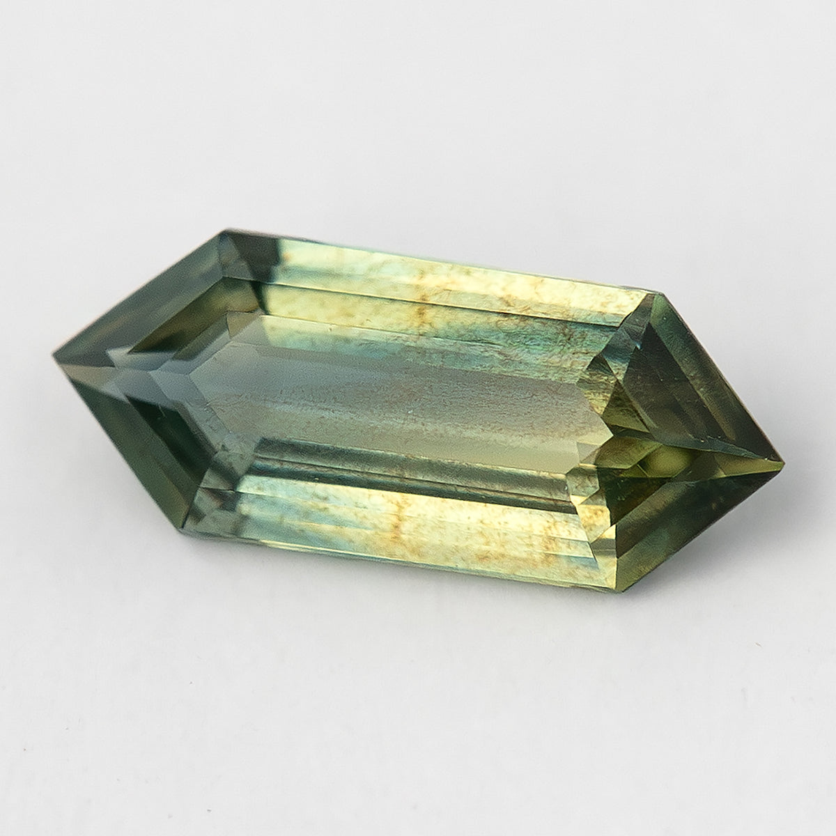 Alternate daylight view of available #1 BNS151 yellowish olive-green sapphire.