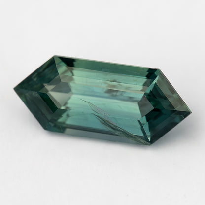 Alternate daylight view of available #3 BNS153 deep teal sapphire.