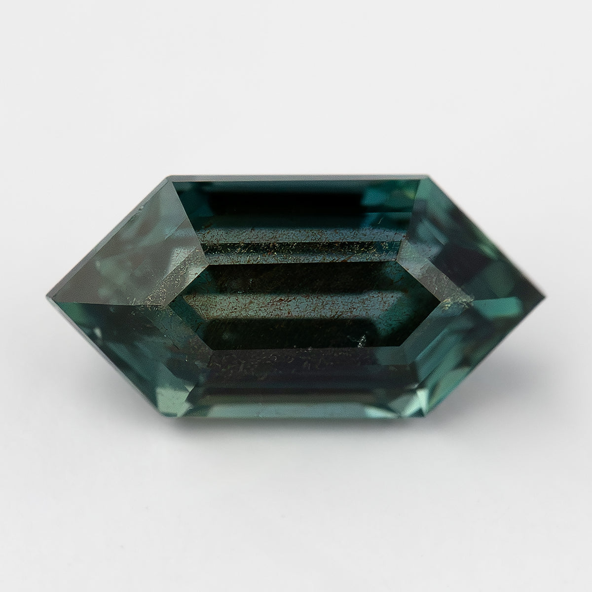 Individual view of sold #4 BNS156 deep green teal sapphire for reference.