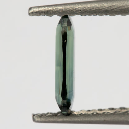 Edge-on tweezers view showing the sapphire’s very shallow side profile.