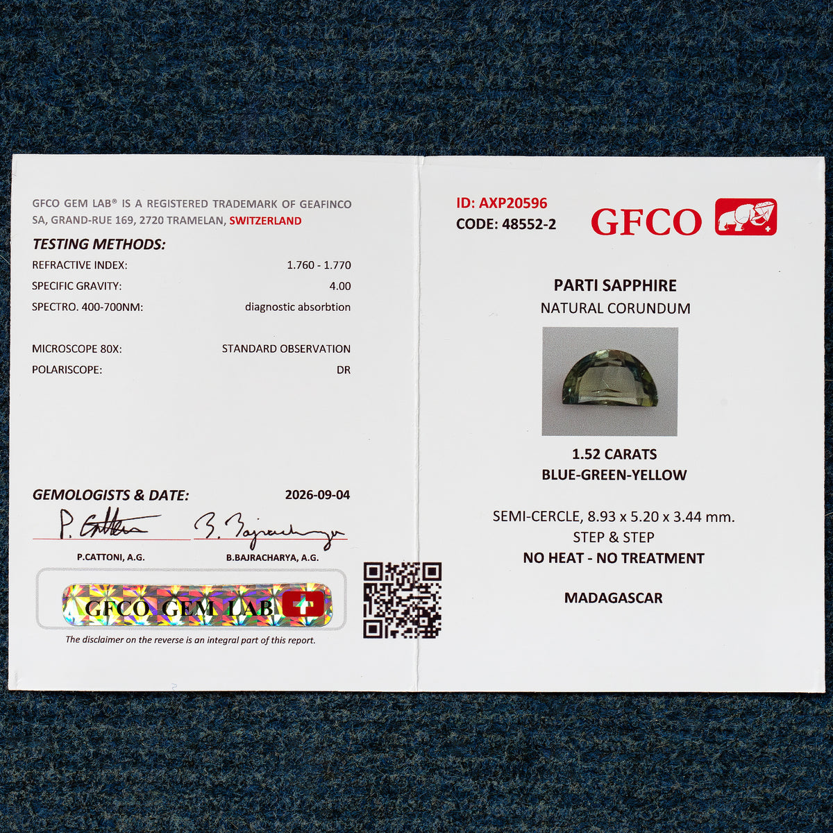 GFCO report AXP20596 for a 1.52ct natural parti sapphire, listing blue-green-yellow color, 8.93x5.20x3.44mm measurements, no heat or treatment, and Madagascar origin.