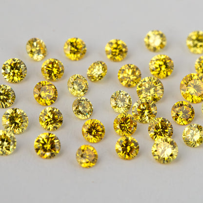 Face-up yellow diamond cluster showing varied reflection patterns and yellow tones.