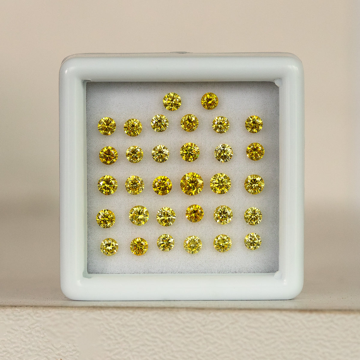 Yellow-diamond tray standing on a pale wood surface.