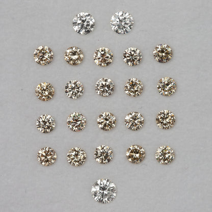 Representative 2.5mm champagne diamond melee with white comparison diamonds that are not included.