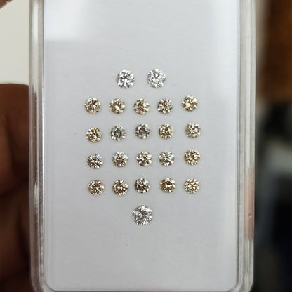 Close parcel view of representative 2.5mm champagne diamond melee under natural light.