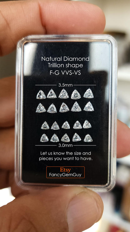 A case of trillion-cut diamonds with printed 3.5 mm and 3.0 mm comparison labels, F-G VVS-VS wording, and FancyGemGuy branding. Representative stock.