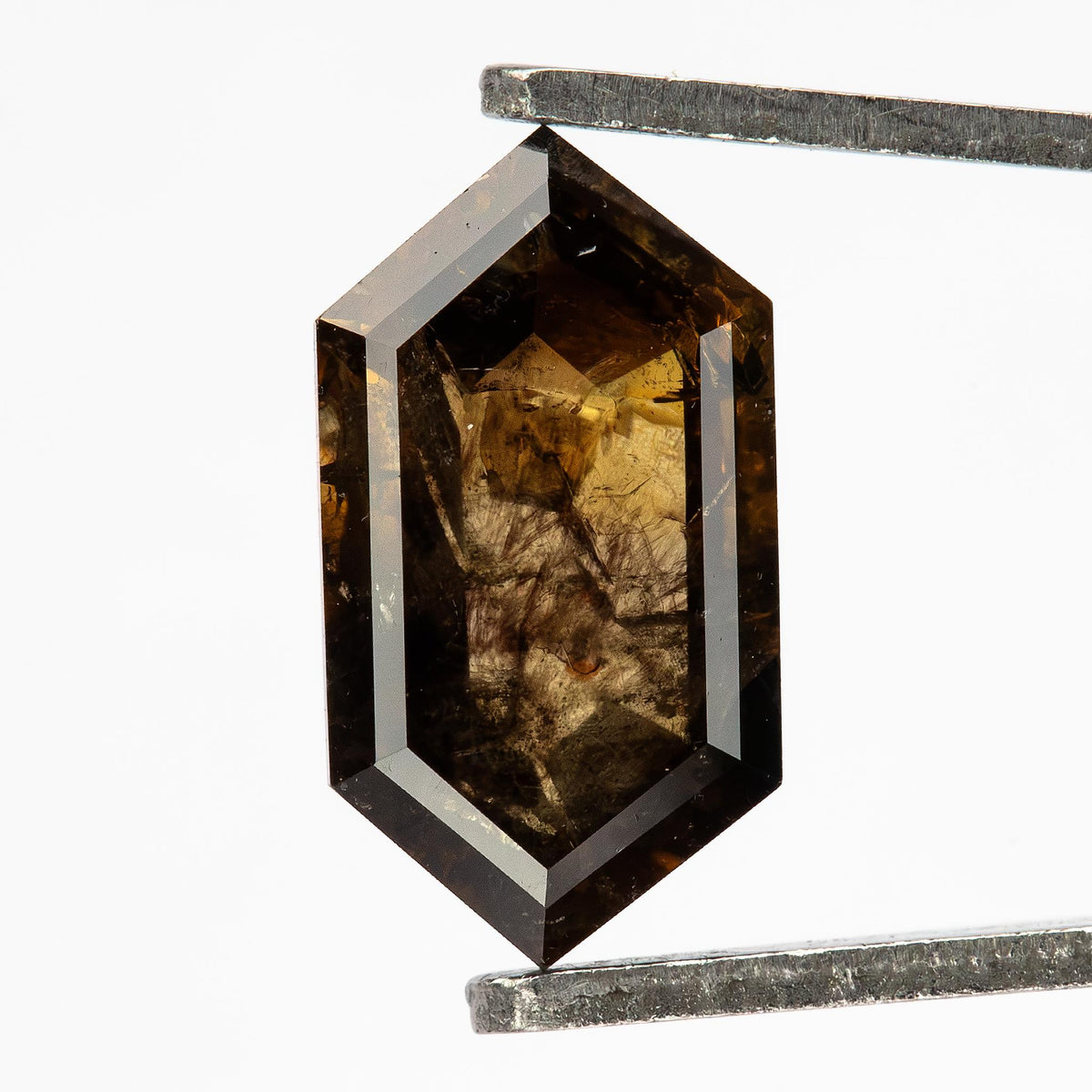 Opposite faceted face of the exact dark brown diamond, showing its geometric facet arrangement and natural inclusion pattern.