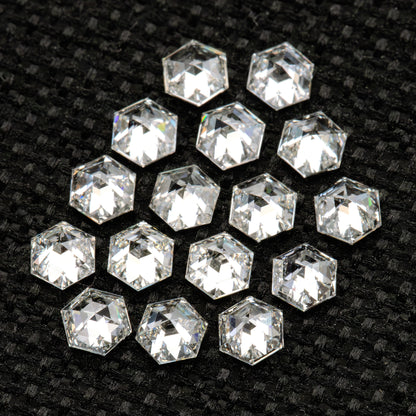 Closer angled view of the reverse-facing hexagonal diamond group on textured black fabric.