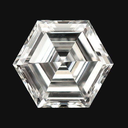 Isolated close-up of a hexagonal diamond against a plain black background, showing concentric step facets.
