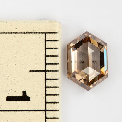 Diamond beside a ruler for millimeter scale. IGI-HEXA-5925-0110CT.