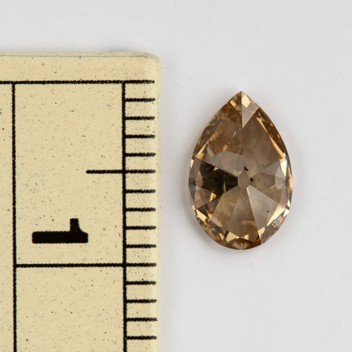 Diamond beside a ruler for scale. IGI-PS-5923-0103CT.