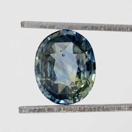 Muted Blue Champagne Bicolor Sapphire | 1.47 Ct Natural Unheated Oval Cut | Eye Clean Gemstone for Fine Jewelry & Rings