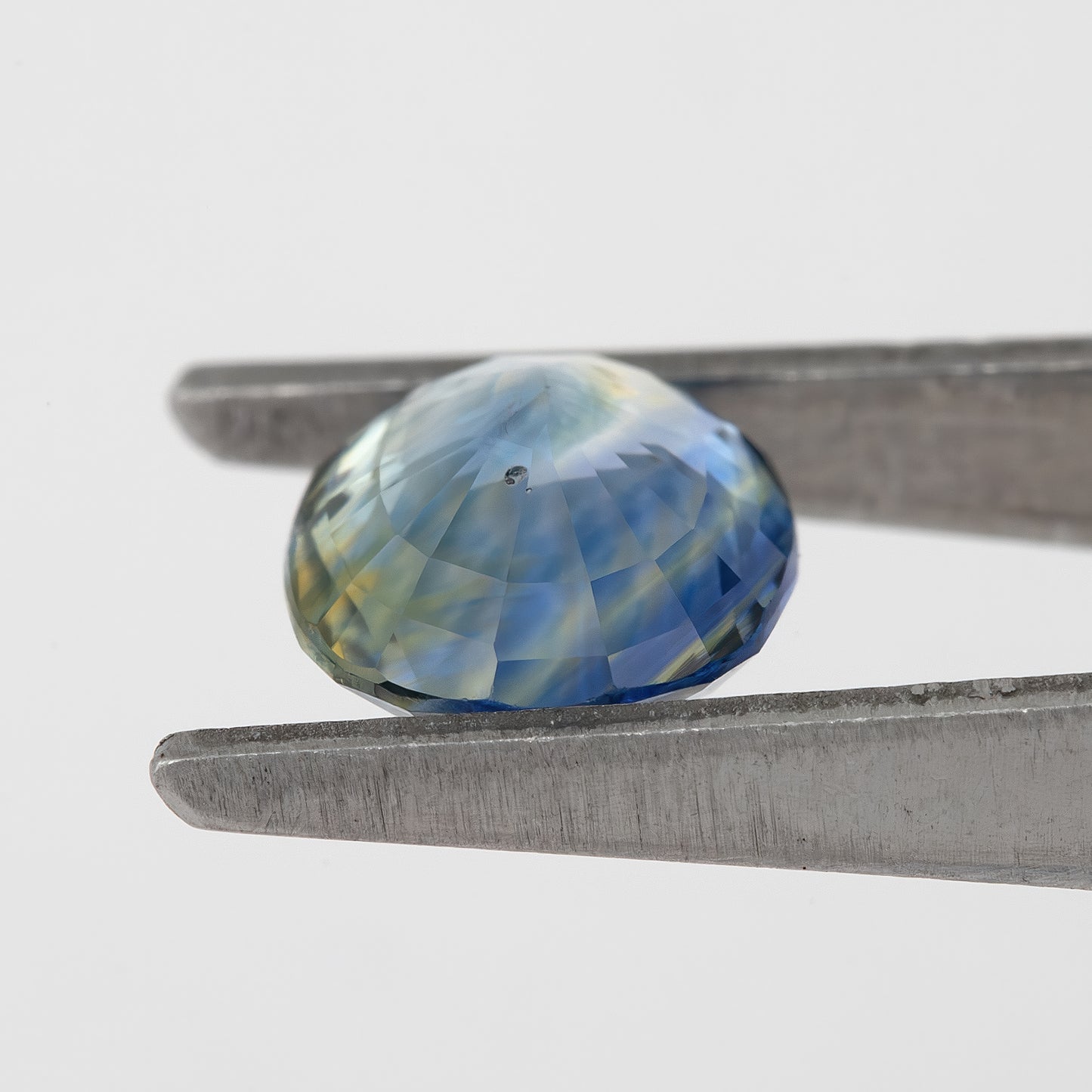 Muted Blue Champagne Bicolor Sapphire | 1.47 Ct Natural Unheated Oval Cut | Eye Clean Gemstone for Fine Jewelry & Rings