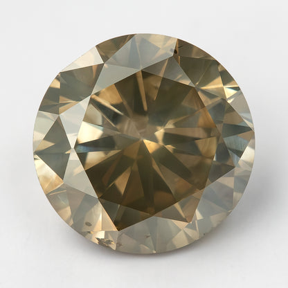 Face-up KL444 round natural diamond on a light background, showing champagne-brown color, olive-gray reflections and visible features near the edge.