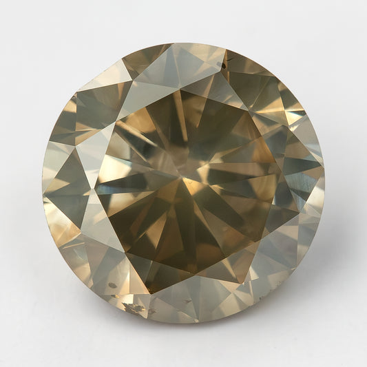 Face-up KL444 round natural diamond on a light background, showing champagne-brown color, olive-gray reflections and visible features near the edge.