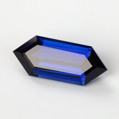 Blue sapphire at a reflective tilt, with a broad pale central reflection bordered by blue step facets.