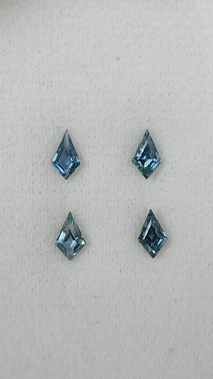 Four kite-shaped teal sapphires viewed face-up. View 7.
