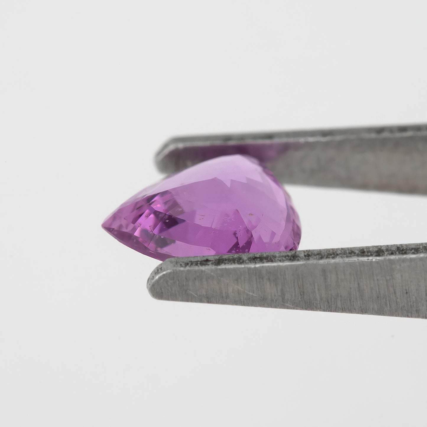 Bright Pinkish Purple Sapphire | 0.66ct Trillion Cut Heated Natural Gemstone | For Unique Engagement Rings & Fine Jewelry
