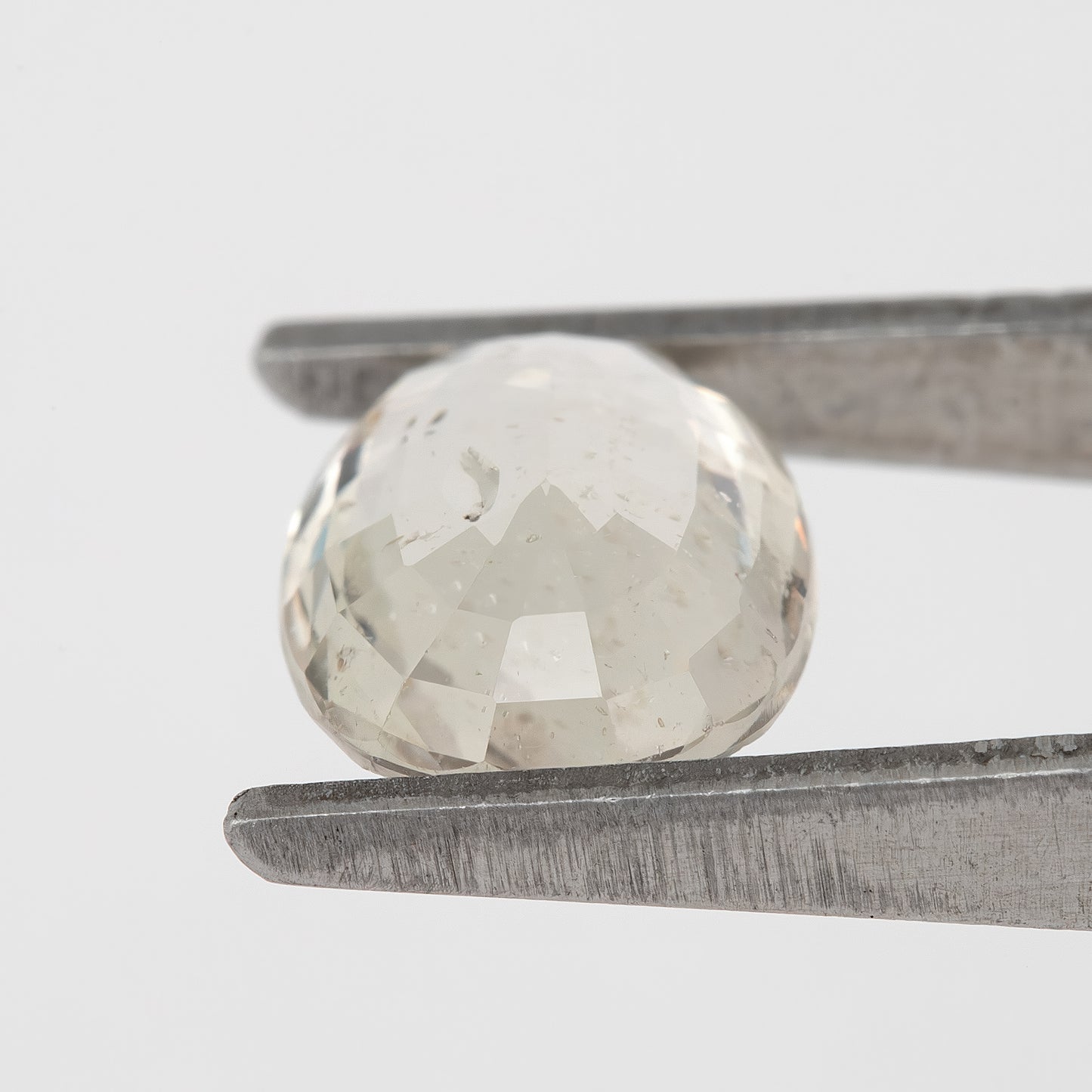 Champagne White | 1.75 Carat Oval Cut Heated Natural Sapphire with Rustic Inclusions for Artisan Jewelry Designs