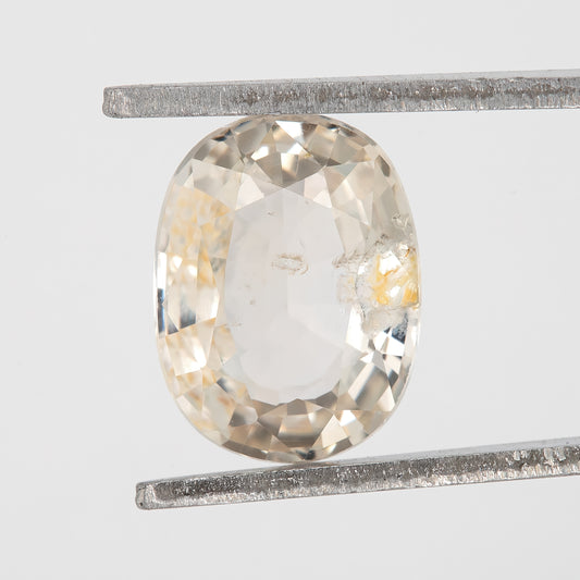 Champagne Cream | 1.74 Carat Oval Cut Heated Natural Sapphire with Rustic Eye Inclusions for Custom Jewelry Design