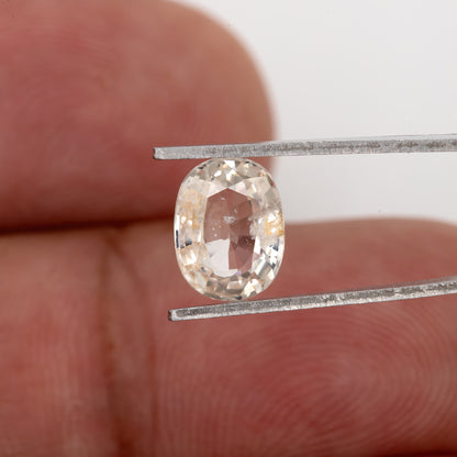 Champagne Cream | 1.74 Carat Oval Cut Heated Natural Sapphire with Rustic Eye Inclusions for Custom Jewelry Design