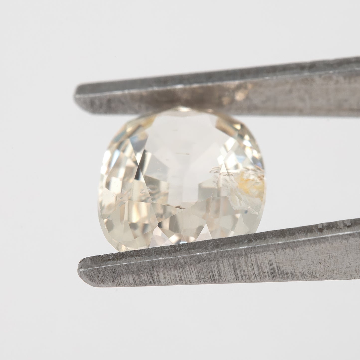 Champagne Cream | 1.74 Carat Oval Cut Heated Natural Sapphire with Rustic Eye Inclusions for Custom Jewelry Design