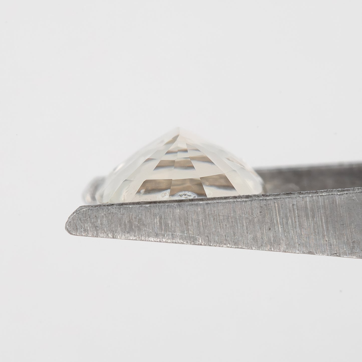 Champagne Cream | 1.74 Carat Oval Cut Heated Natural Sapphire with Rustic Eye Inclusions for Custom Jewelry Design