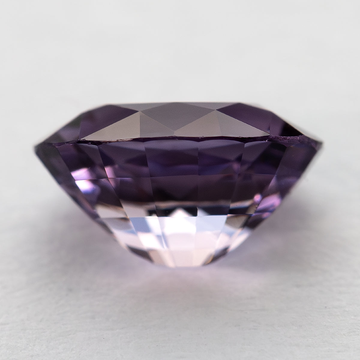 Side profile of oval spinel showing crown, girdle and pavilion depth.