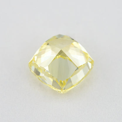 Pavilion and back view of the cushion-shaped yellow diamond, showing broad rear facets and its outline.