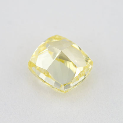 Pavilion and back view of the cushion-shaped yellow diamond, showing broad rear facets and its outline.