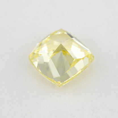 Pavilion and back view of the cushion-shaped yellow diamond, showing broad rear facets and its outline.