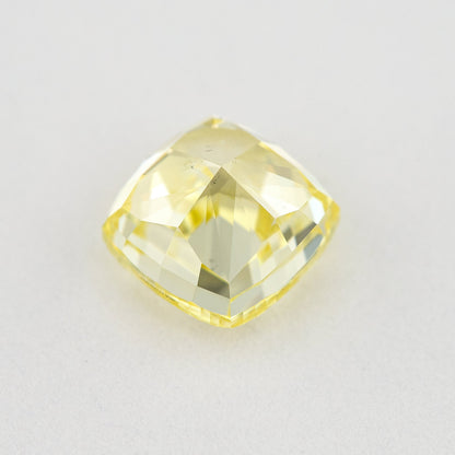 Pavilion and back view of the cushion-shaped yellow diamond, showing broad rear facets and its outline.