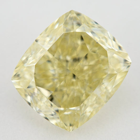 Face-up pale yellow cushion-shaped diamond on a pale background, with the full outline and crown facets visible.