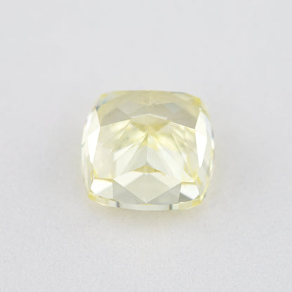 Pavilion and back view of the cushion-shaped yellow diamond, showing broad rear facets and its outline.