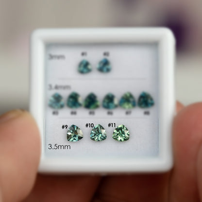 Numbered 3.5 mm natural teal trillion sapphires #9, #10 and #11, shown face-up for exact-stone selection.